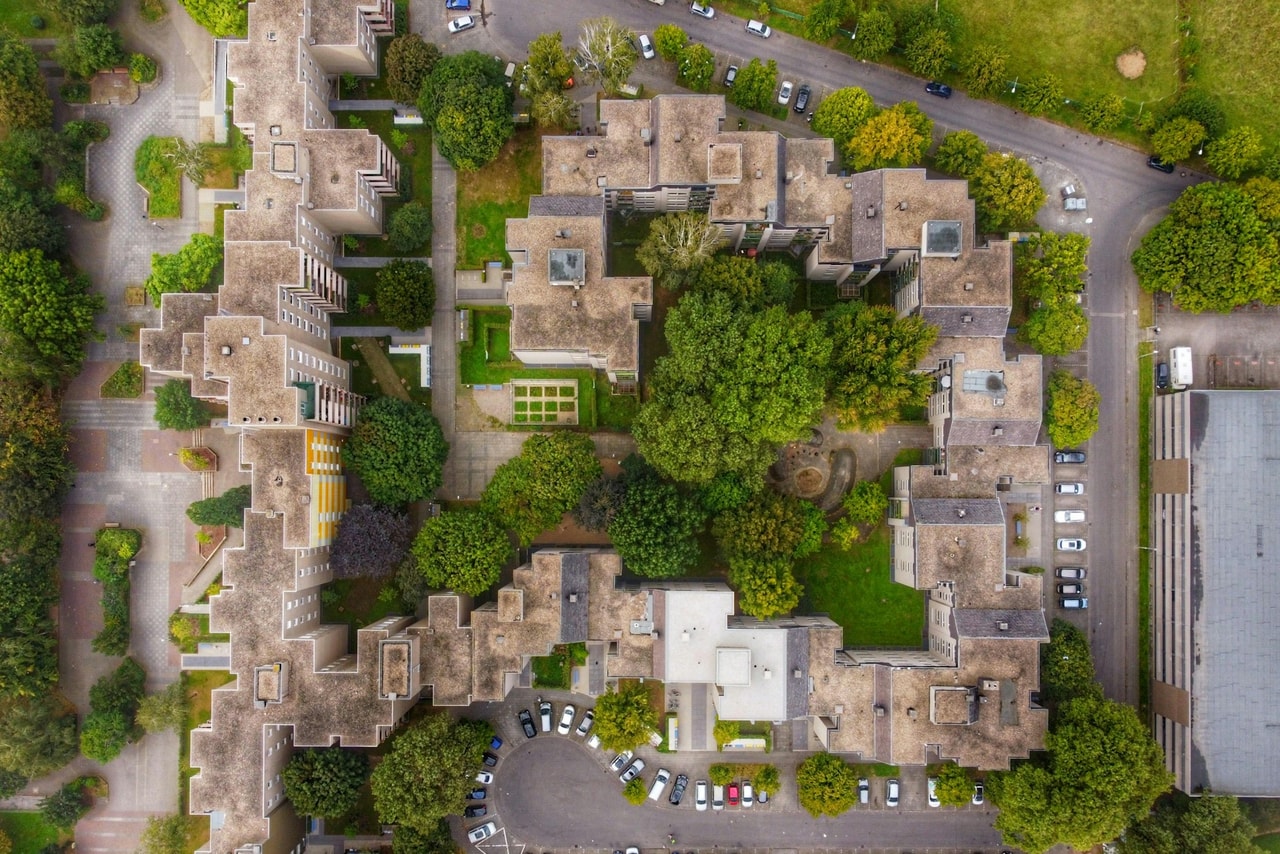 Illustrative apartment-building photograph, not the example property